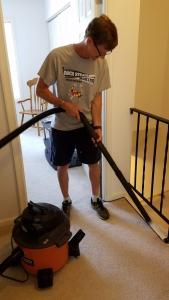 Pastor Mike from Living Grace Lutheran Church Vacuuming and House Sitting for a Homeowner who Had an Emergency